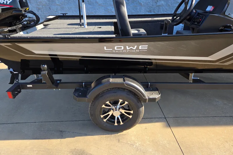Slide: The Image of 2027 Lowe Skorpion 16 boat on trailer, showcasing sleek design and modern features. - 3