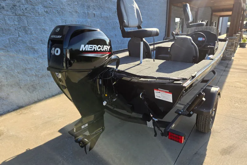 Slide: The Image of 2027 Lowe Skorpion 16 boat with Mercury 40 engine, parked on a trailer. - 2