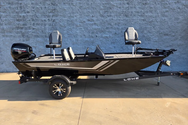 The Image of 2027 Lowe Skorpion 16 fishing boat with Mercury engine on trailer, parked outdoors. - 1