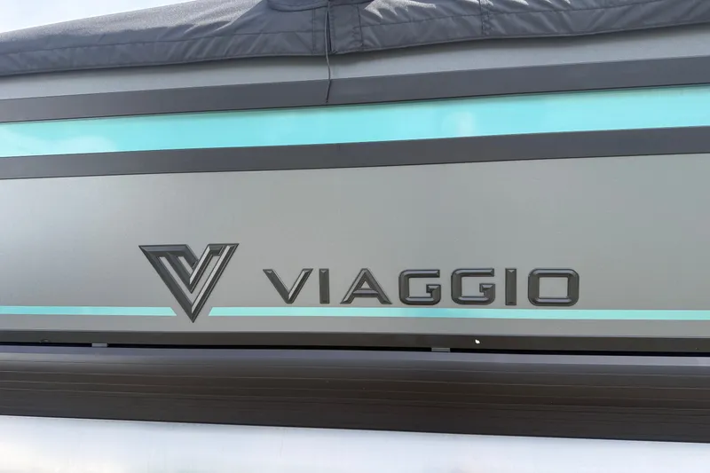Slide: The Image of Viaggio x22u 2027 model logo on sleek metallic surface with turquoise accents. - 31