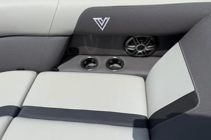 Slide: The Image of Viaggio x22u 2027 boat interior with speaker and cup holders, featuring sleek gray and white upholstery. - 18