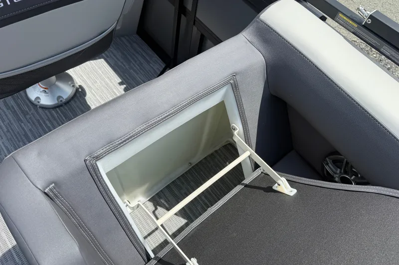 Slide: The Image of Viaggio x22u 2027 boat interior with open storage compartment and gray seating. - 16