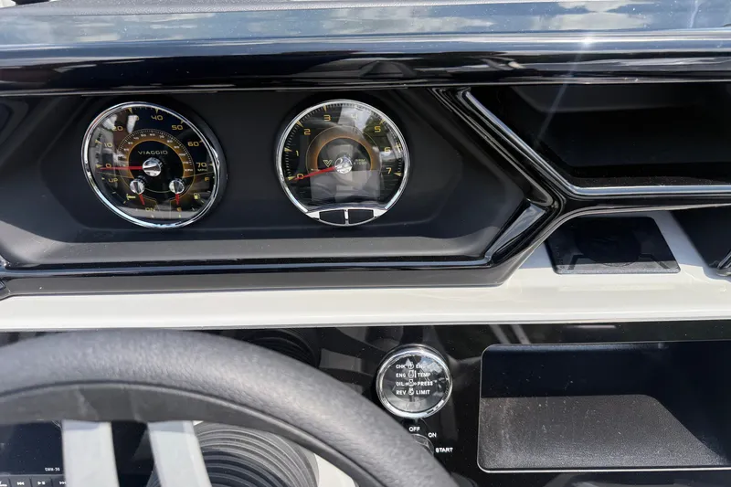 Slide: The Image of Dashboard of a 2027 Viaggio x22u with speedometer and tachometer gauges. - 23