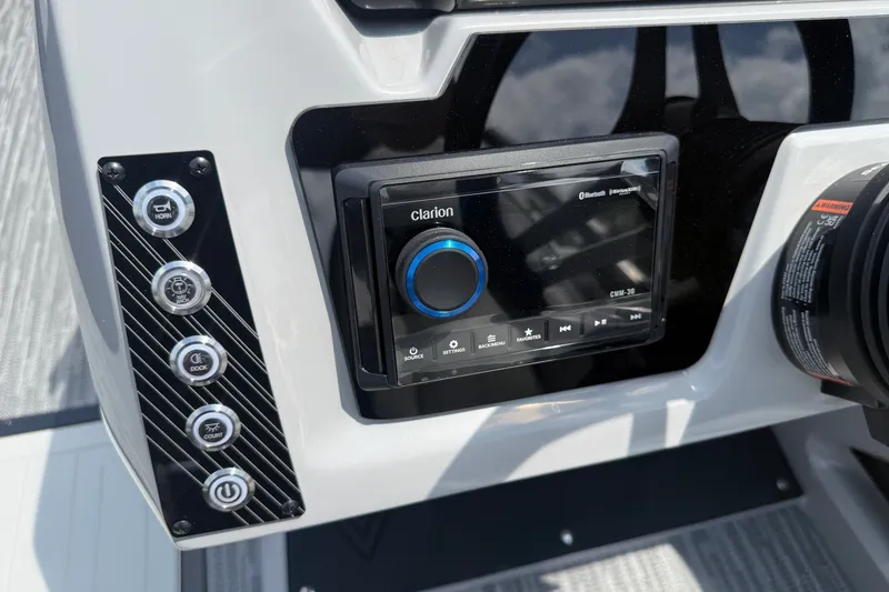 Slide: The Image of Dashboard of Viaggio x22u 2027 with Clarion audio system and control buttons. - 24
