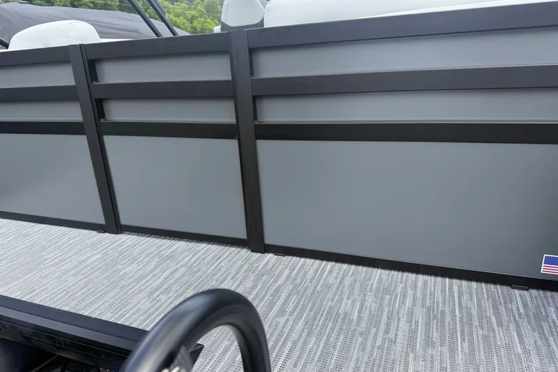 Slide: The Image of 2027 Viaggio x22u boat interior with sleek gray paneling and textured flooring. - 28