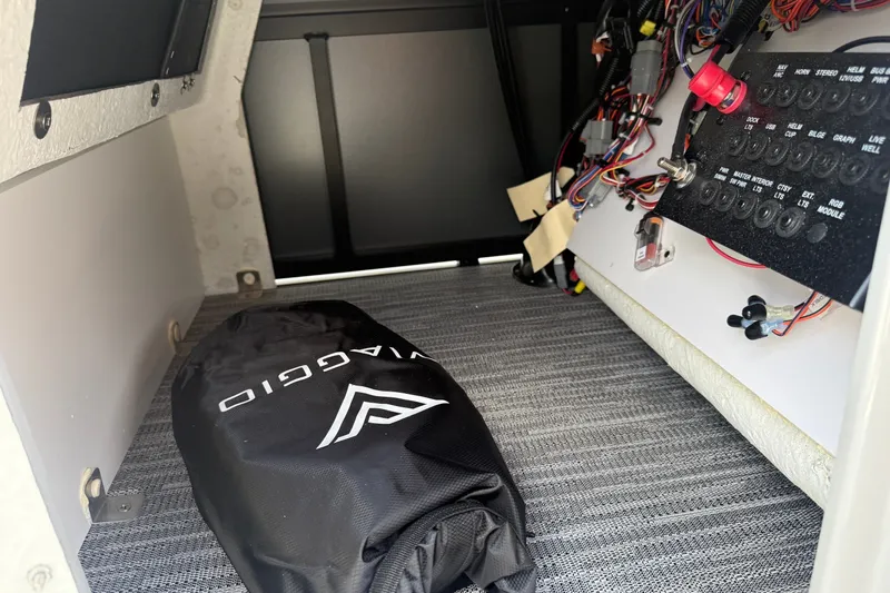 Slide: The Image of Interior view of Viaggio x22u 2027 model showing wiring and storage bag. - 25
