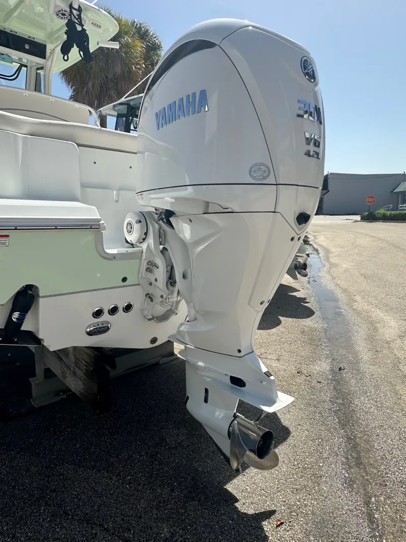 Slide: The Image of A Yamaha outboard motor is mounted on the stern of a Sea Hunt Ultra 255SE boat. - 3