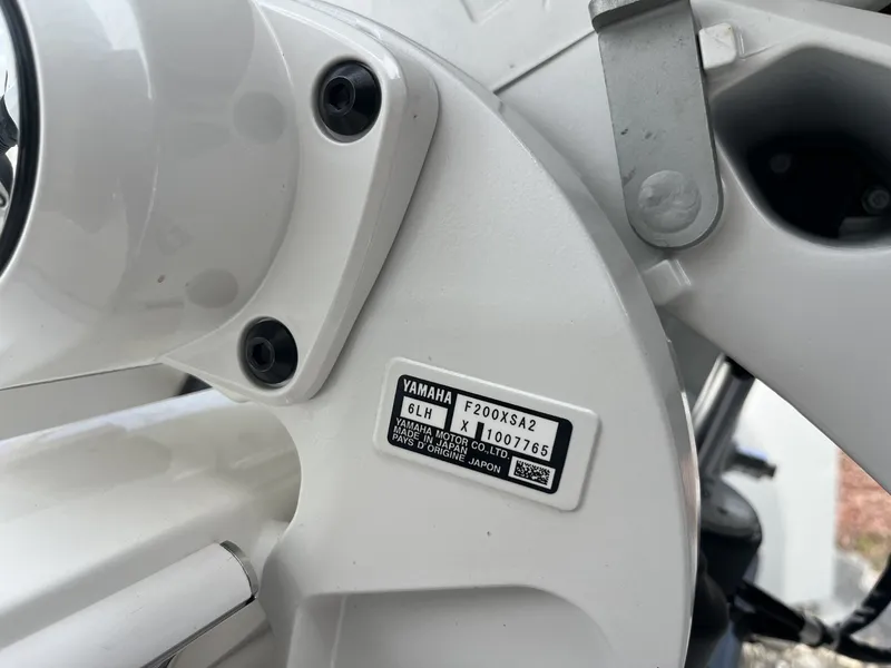 Slide: The Image of Close-up of a Yamaha engine on a Cobia 265 Center Console boat. - 10
