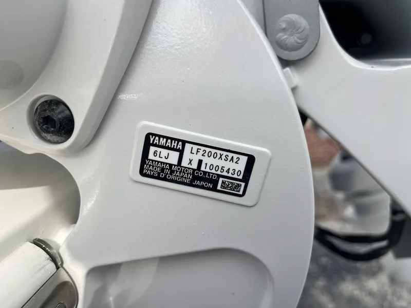 Slide: The Image of Close-up of a Yamaha engine part with serial number and model information. - 9