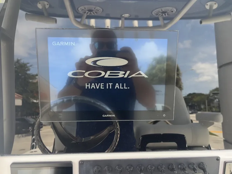 Slide: The Image of A Garmin screen on a Cobia 265 Center Console boat displays "HAVE IT ALL." - 19