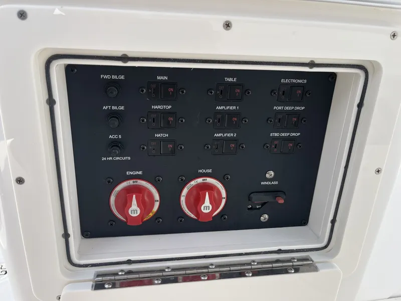 Slide: The Image of Control panel with toggle switches and dials for various boat functions. - 34