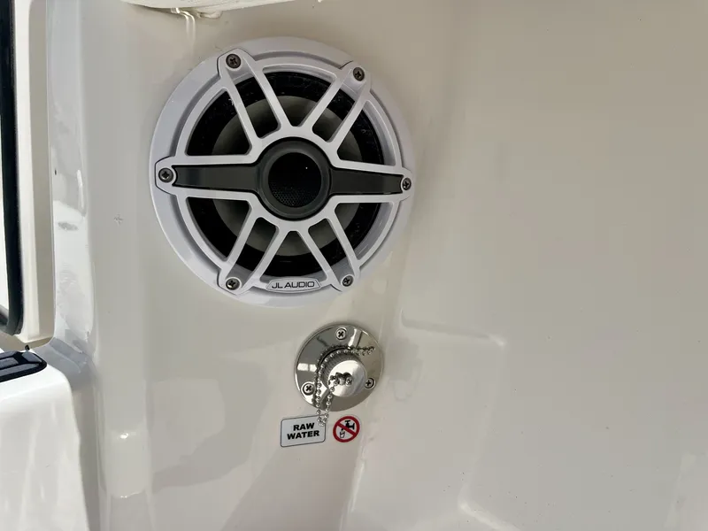 Slide: The Image of A speaker and water connection are mounted on the white boat wall. - 39