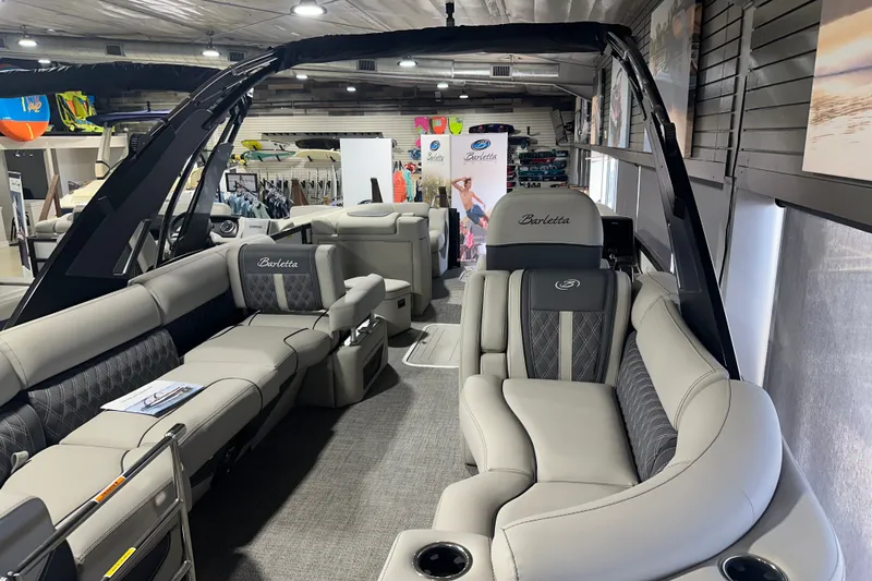 Slide: The Image of 2025 Barletta LUSSO 23QSSA luxury pontoon boat interior with plush seating and modern design. - 16