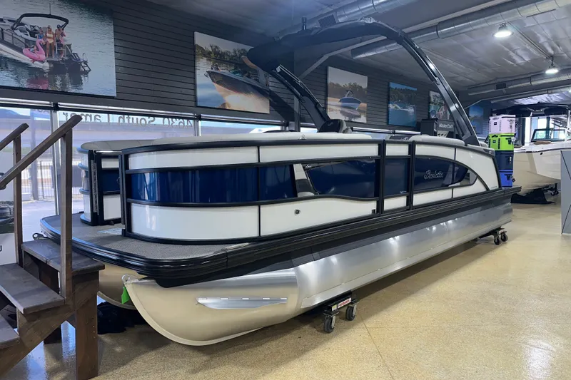 Slide: The Image of 2025 Barletta LUSSO 23QSSA pontoon boat displayed indoors, showcasing sleek design. - 1