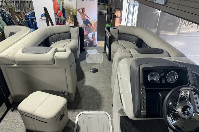 Slide: The Image of 2025 Barletta LUSSO 23QSSA pontoon boat interior with luxurious seating and modern dashboard. - 12
