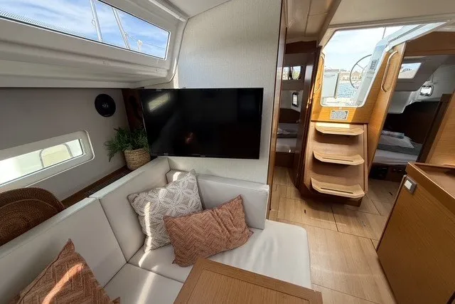 Slide: The Image of Interior of 2022 Jeanneau Sun Odyssey 410 yacht with cozy seating and modern decor. - 36