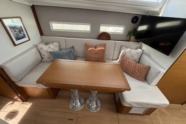Slide: The Image of Interior of 2022 Jeanneau Sun Odyssey 410 with cozy seating and modern decor. - 34