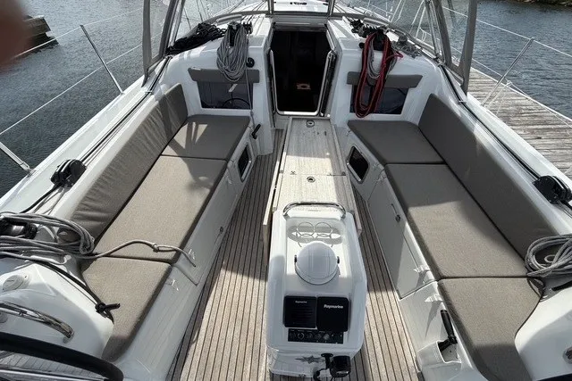 Slide: The Image of Modern Jeanneau Sun Odyssey 410 yacht cockpit with cushioned seating, 2022 model. - 7
