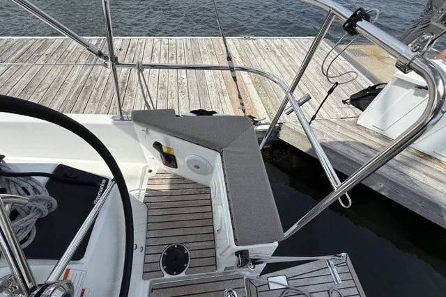 Slide: The Image of Cockpit seating area of 2022 Jeanneau Sun Odyssey 410 sailboat at dock. - 16