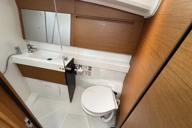Slide: The Image of Modern bathroom in 2022 Jeanneau Sun Odyssey 410 yacht, featuring sleek design and compact functionality. - 55