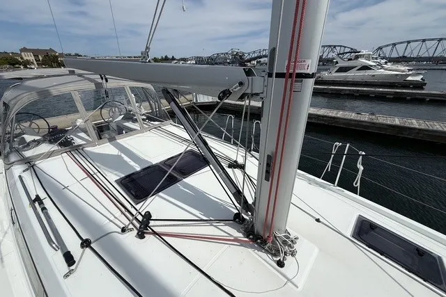 Slide: The Image of 2022 Jeanneau Sun Odyssey 410 sailboat docked, showcasing deck and rigging details. - 26