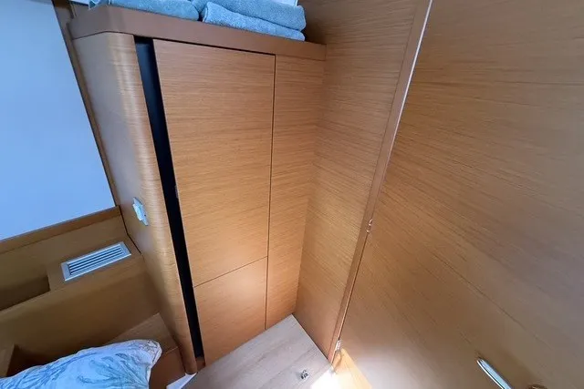 Slide: The Image of Interior cabin of 2022 Jeanneau Sun Odyssey 410 yacht with wooden finish. - 48