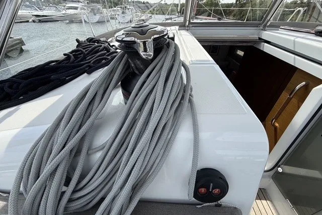 Slide: The Image of Deck view of 2022 Jeanneau Sun Odyssey 410 sailboat with ropes and winch. - 21