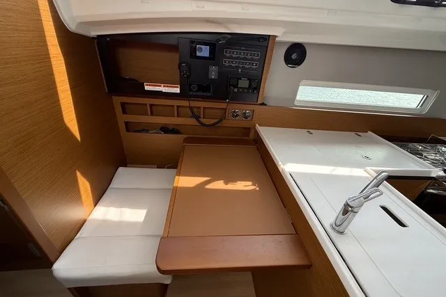 Slide: The Image of Interior of 2022 Jeanneau Sun Odyssey 410 yacht with navigation station and seating area. - 43