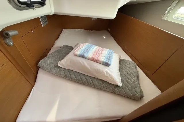 Slide: The Image of Cozy cabin bed in 2022 Jeanneau Sun Odyssey 410 yacht interior. - 53