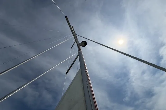 Slide: The Image of Sailboat mast of 2022 Jeanneau Sun Odyssey 410 against a cloudy sky. - 29