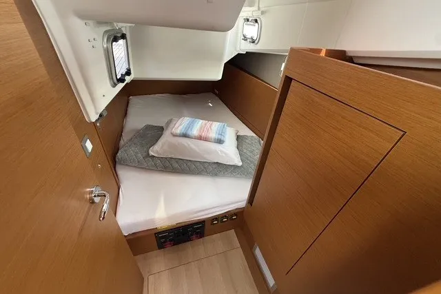 Slide: The Image of Cozy cabin interior of 2022 Jeanneau Sun Odyssey 410 sailboat with wooden finish. - 52
