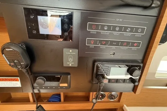 Slide: The Image of Control panel of 2022 Jeanneau Sun Odyssey 410 sailboat with navigation and communication equipment. - 44