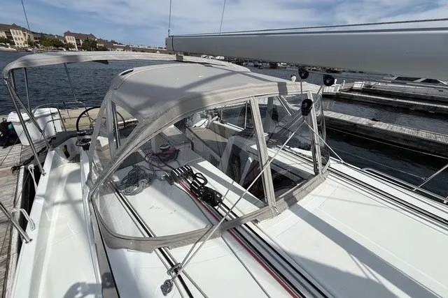 Slide: The Image of 2022 Jeanneau Sun Odyssey 410 sailboat docked, featuring a sleek design and spacious cockpit. - 25