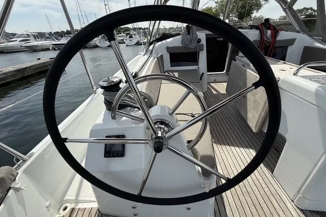 Slide: The Image of Steering wheel of 2022 Jeanneau Sun Odyssey 410 sailboat at marina. - 10