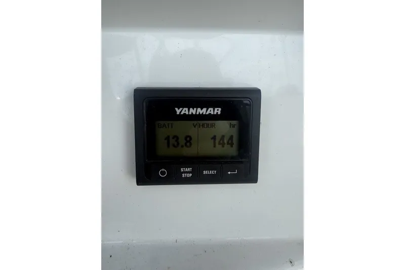 Slide: The Image of Digital display on Jeanneau Sun Odyssey 410, showing battery voltage and engine hours. - 15