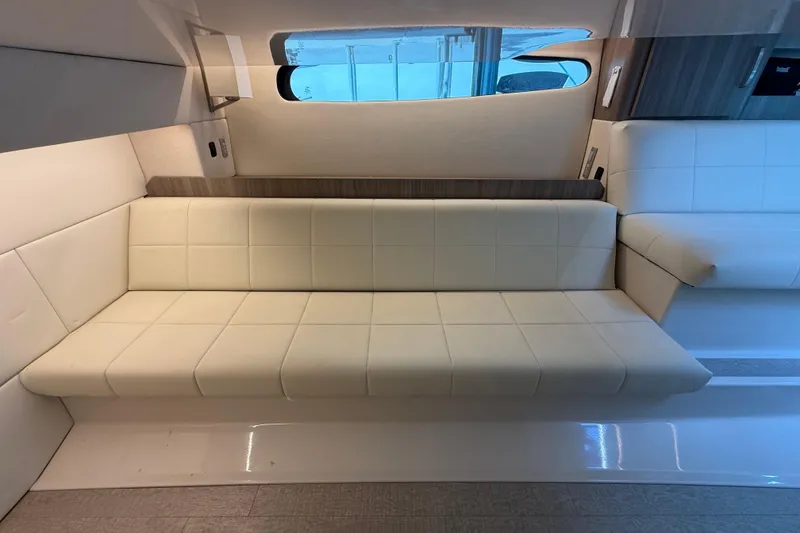 Slide: The Image of Luxurious interior seating of 2023 Regal 36 XO yacht, featuring elegant white upholstery. - 39