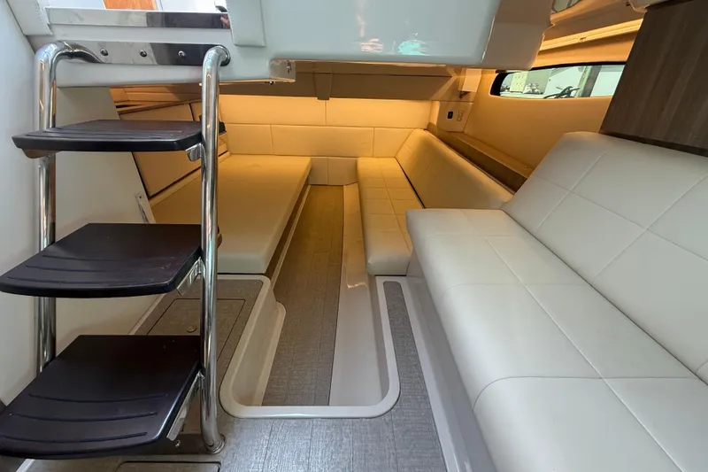 Slide: The Image of Luxurious interior of 2023 Regal 36 XO yacht with modern seating and sleek design. - 37