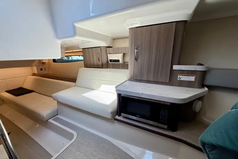 Slide: The Image of Luxurious interior of 2023 Regal 36 XO yacht with modern seating and kitchenette. - 35