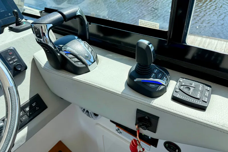 Slide: The Image of Control panel of 2023 Regal 36 XO boat with joystick and throttle. - 24