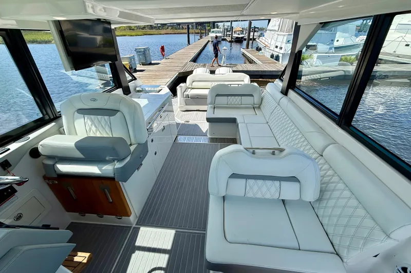 Slide: The Image of Luxurious interior of 2023 Regal 36 XO yacht with plush seating and modern amenities. - 22