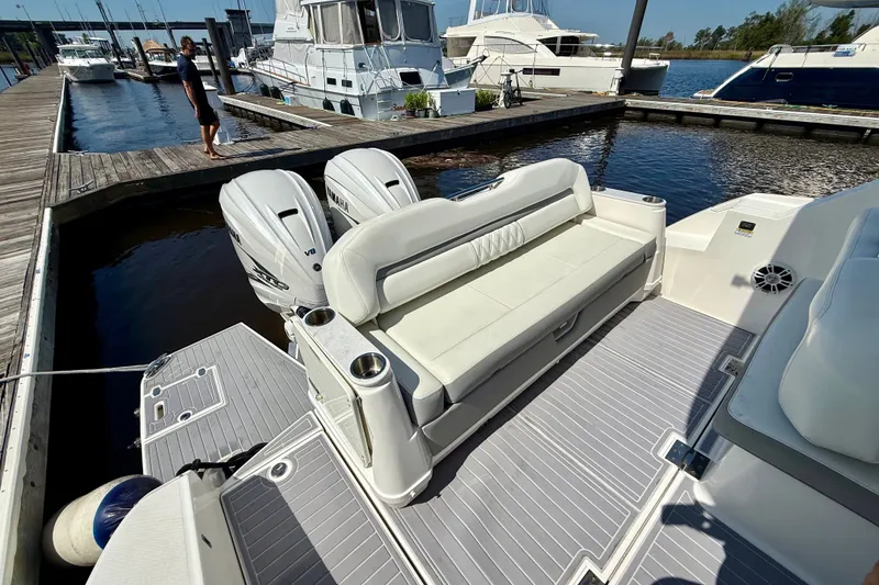 Slide: The Image of 2023 Regal 36 XO yacht with twin Yamaha engines docked at marina. - 15