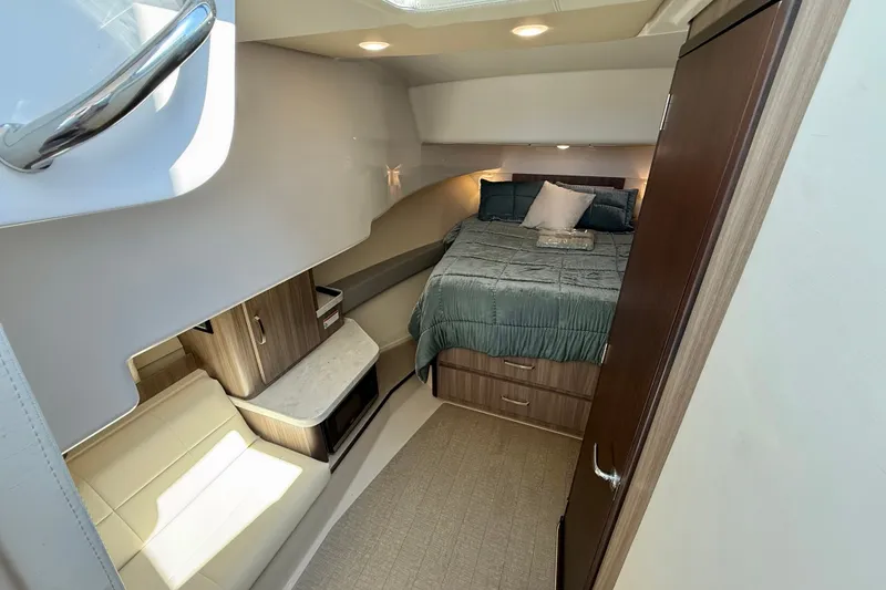 Slide: The Image of Luxurious cabin interior of 2023 Regal 36 XO yacht with bed and seating area. - 31