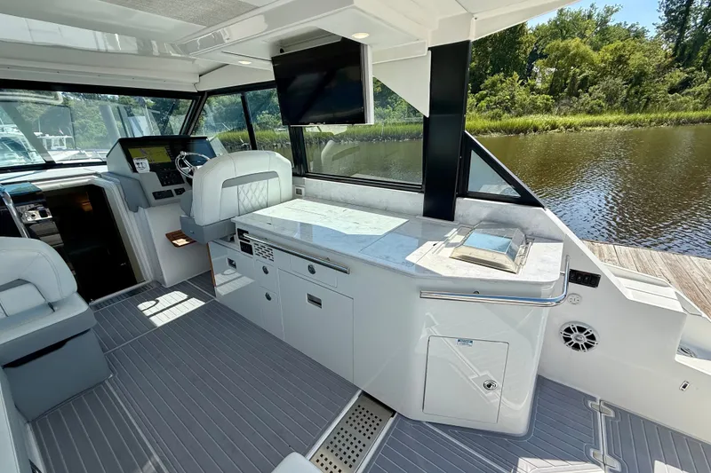 Slide: The Image of Luxurious interior of 2023 Regal 36 XO yacht with modern helm and seating. - 17