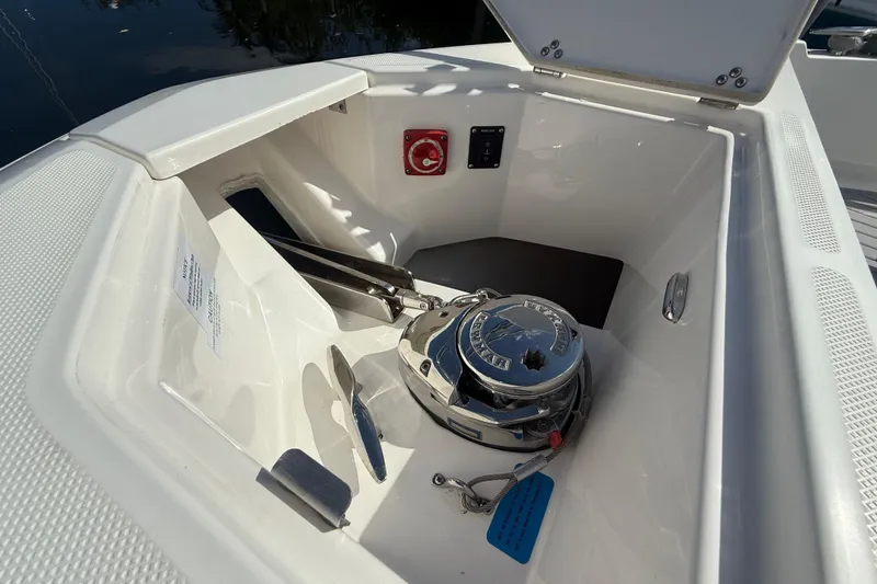 Slide: The Image of Anchor compartment of 2023 Regal 36 XO boat with winch and control panel. - 30