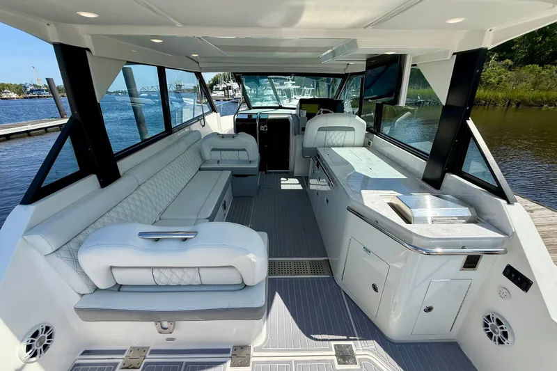 Slide: The Image of Luxurious interior of 2023 Regal 36 XO yacht with elegant seating and modern amenities. - 18