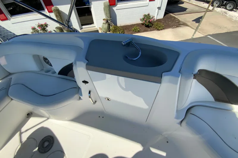 Slide: The Image of Interior view of 2010 Hurricane SunDeck Sport 200 OB boat with seating and sink. - 18