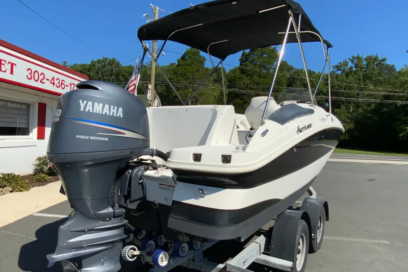 Slide: The Image of 2010 Hurricane SunDeck Sport 200 OB boat with Yamaha outboard motor on trailer. - 9