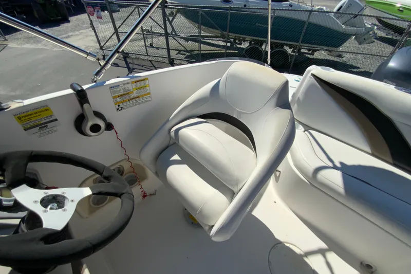 Slide: The Image of Captain's seat and steering wheel of 2010 Hurricane SunDeck Sport 200 OB boat. - 24