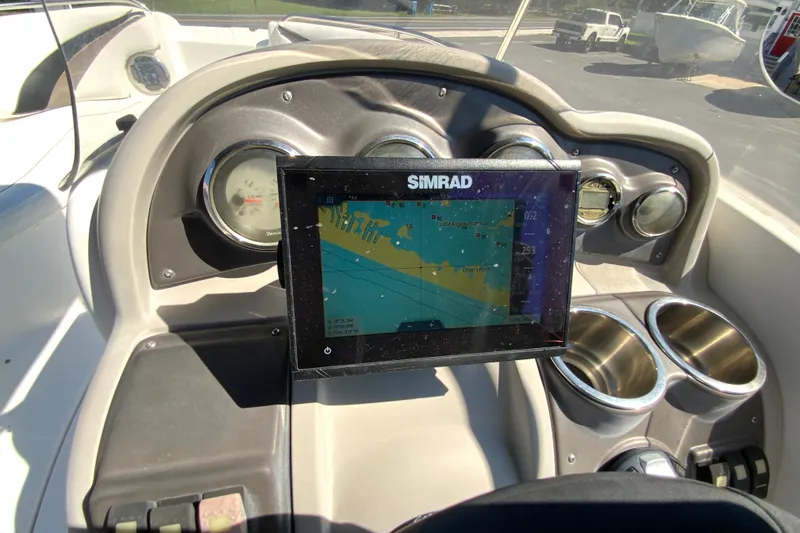 Slide: The Image of Dashboard of 2010 Hurricane SunDeck Sport 200 OB with Simrad navigation display. - 13