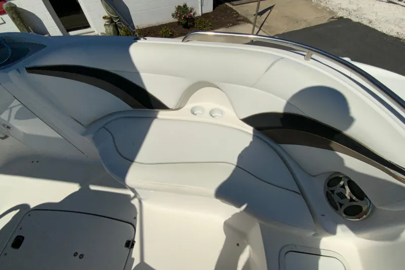 Slide: The Image of 2010 Hurricane SunDeck Sport 200 OB boat interior with seating and speaker. - 16